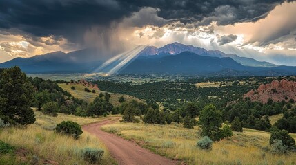 Obraz premium Dramatic Mountain Landscape with Rays of Sunlight Shining Down