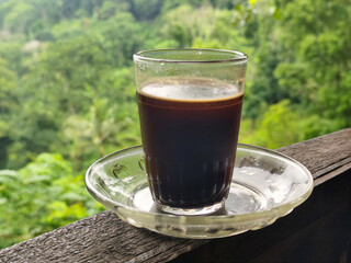 A cup of coffee while enjoying the beautiful mountain view.