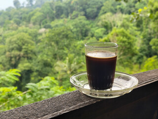 A cup of coffee while enjoying the beautiful mountain view.