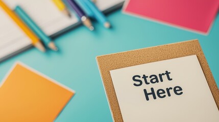 Figure it out Concept, Close-Up of Brainstorming Station with Colorful Notes and a Sign that Reads "Start Here"