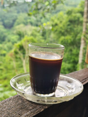 A cup of coffee while enjoying the beautiful mountain view.