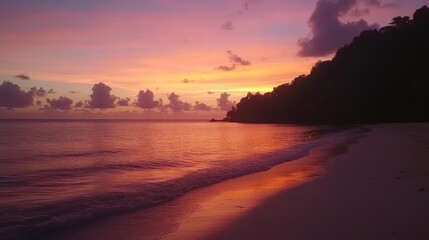 Obraz premium Serene Sunset Over Tropical Beach with Colorful Sky Reflections
