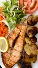 traditional portuguese cuisine, fish, meat with mushrooms, salad and fried potatoes and rice