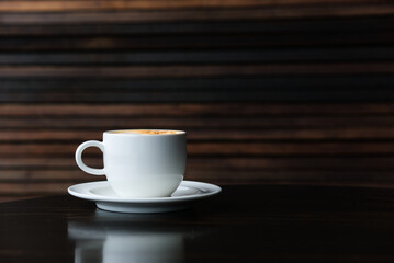Hot coffee placed on the table, clear photo with blurred background