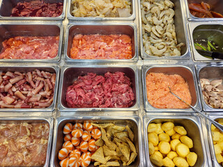 assortment of raw meat display for barbecue and hotpot 