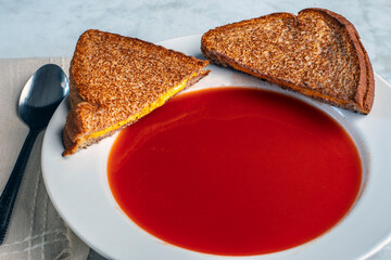 tomato soup with  a cheese melt sandwich