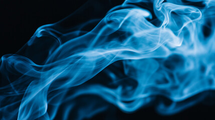 Obraz premium Blue smoke swirling in the darkness creating a mystical atmosphere.