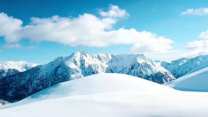A stunning view of a snow-covered mountain range with rolling hills of snow and a bright blue sky. Distant peaks stand majestically, providing a serene winter scene.