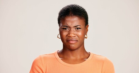 Black woman, portrait and expression in studio for disgust, disapproval and reaction to smell....