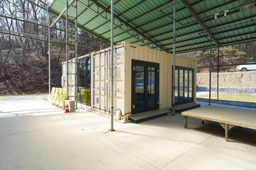 Buildings constructed by combining modular shipping containers, repurposed into cultural spaces, storage, and creative architecture.