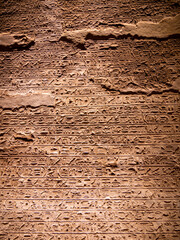 Hieroglyphs carved into the walls inside the Great Temple of Ramesses II, Abu Simbel, Egypt - Portrait Shot