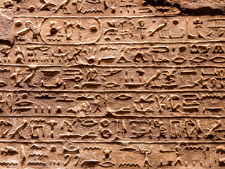 Hieroglyphs carved into the walls inside the Great Temple of Ramesses II, Abu Simbel, Egypt -...