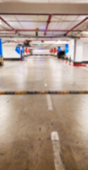 photo blurred car parking lot indoors square row on the side of the building. Leave space empty for write text.
