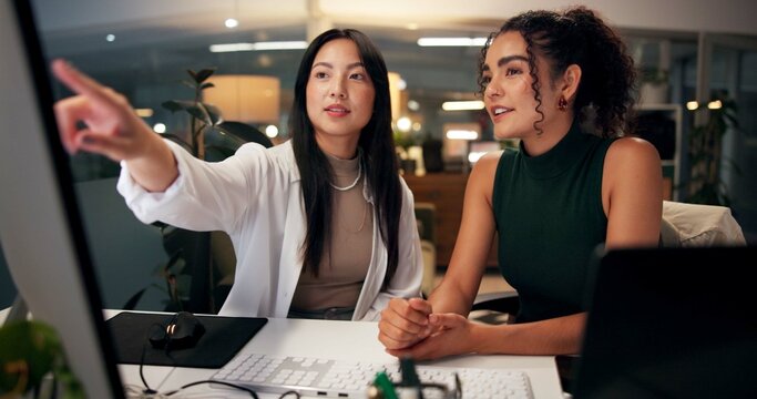 Teamwork, computer and training with business people in office for overtime, web design or learning update. Blog homepage, showing and helping with women and feedback in digital agency at night