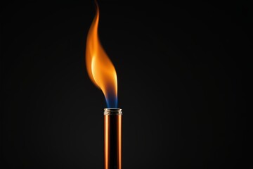 a burning match on a black background