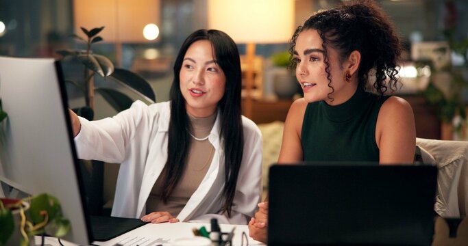Teamwork, computer and pointing with business people in office for tech startup, web design and research overtime. Software developer, collaboration and deadline with women in digital agency at night