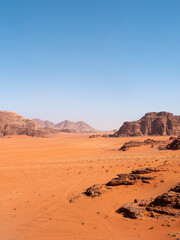 Fototapeta premium Desert Landscape in Wadi Rum, Jordan on a clear day - Portrait Shot