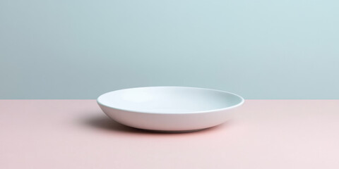 White ceramic plate on pastel background, minimalistic setup.