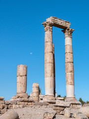 Fototapeta premium Ancient pillars standing at the Amman Citadel, Jordan on a sunny morning - Portrait shot