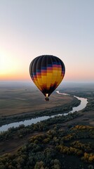 Obraz premium Hot Air Balloon Floating Over Scenic Valley