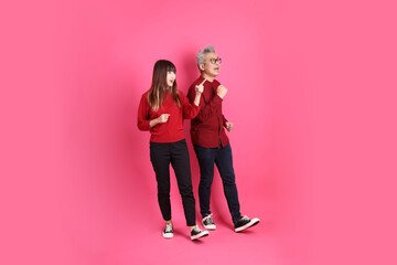 man and woman in red clothes