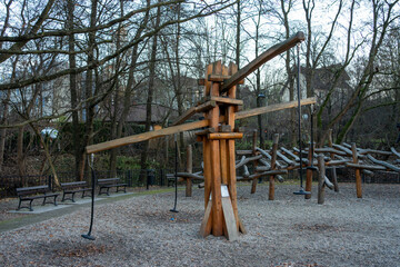 Wooden Playground Structure in a Forest Park Setting