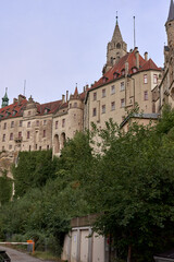 Majestic Sigmaringen Castle Perched on Rugged Cliff Above Tranquil Danube: Historic Hohenzollern Residence Showcases Medieval Architecture and Royal Collections in Picturesque Baden-Wurttemberg