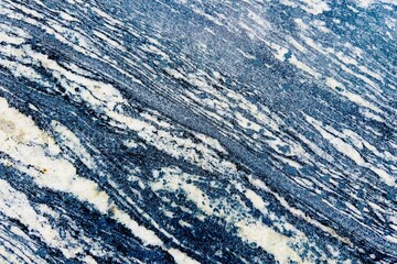 Naklejka premium The blue, gray and white patterns of natural marble or marble with lines and waves of color make it look natural and fluid. The pattern is complex texture and blackglound.