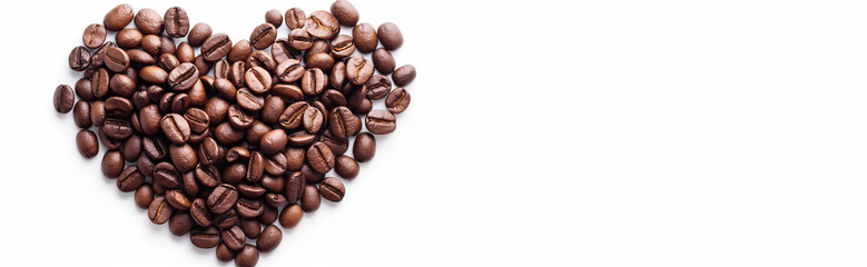 Naklejka premium Heart made of coffee beans isolated on white background. Coffee beans arranged in a heart shape, top view, light background. Heart shape made of coffee beans, Valentine's Day concept, symbol of love