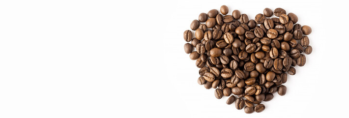 Heart made of coffee beans isolated on white background. Coffee beans arranged in a heart shape, top view, light background. Heart shape made of coffee beans, Valentine's Day concept, symbol of love