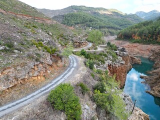 reservoir rocky shore autumn trees 