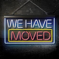 Illuminated "We Have Moved" Neon Sign