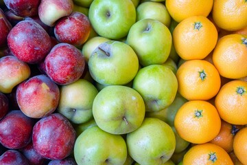 Colorful fruits and vegetables in the produce section of the grocery store.
