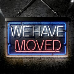 Illuminated "We Have Moved" Neon Sign