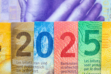 2025 in Swiss franc, Switzerland money, Banknotes arranged in the symbol of 2025, Concept,...