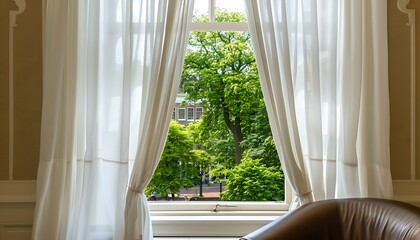 White curtains on window, green trees outside, Dutch cityscape, brown leather chair, beige walls.