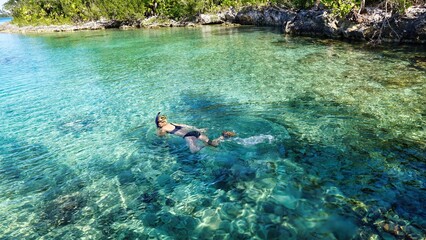 person woman snorkeling in the sea