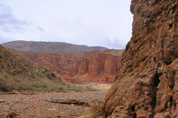 canyon landscape with red rocks in Kyrgyzstan, Central Asia