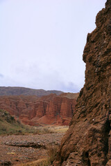 canyon landscape with red rocks in Kyrgyzstan, Central Asia
