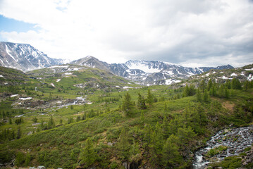Fototapeta premium Aerial view of majestic altai mountains with snow and clouds, Altai Tavan Bogd, Mongolia