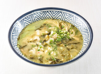 Pickled Fish Rice Noodles Soup topped with scallions served in bowl isolated on white background side view of hong kong food