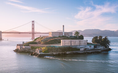 Alcatraz Island and Golden Gate Bridge at sunset.