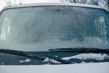snow covered car front window