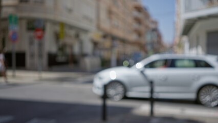 Blurred white car in street with an out-of-focus background, capturing urban scene and bokeh effect...
