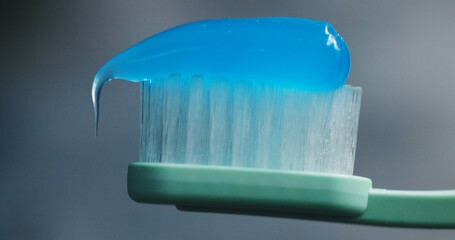 Toothbrush, toothpaste and closeup in bathroom for oral care, dental hygiene and protection. Brush,...