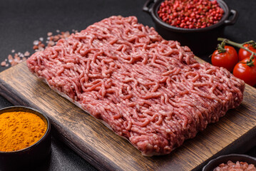 Fresh raw ground minced beef with salt and spices