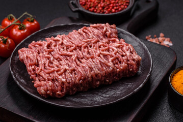 Fresh raw ground minced beef with salt and spices