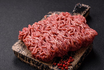 Fresh raw ground minced beef with salt and spices