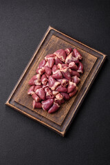 Raw chicken hearts with salt, spices and herbs