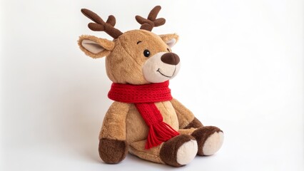 Fototapeta premium Cute Plush Reindeer Toy Sitting with a Red Scarf On a White Background